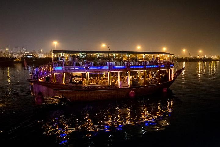 Experience an evening on a traditional dhow savoring delicious cuisine while gliding along Dubai Creek surrounded by the city's shimmering skyline and enchanting melodies.